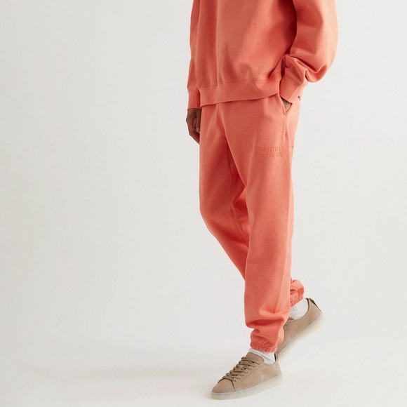Essentials Other - FEAR OF GOD ESSENTIALS - Tapered Logo Blend Jersey Sweatpants in Coral